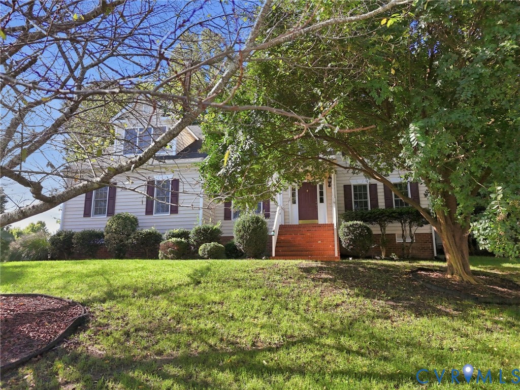 1100 Goswick Ridge Road Midlothian, VA 23114 - Photo 31 of 35 White siding exterior with dark shutters, prominen