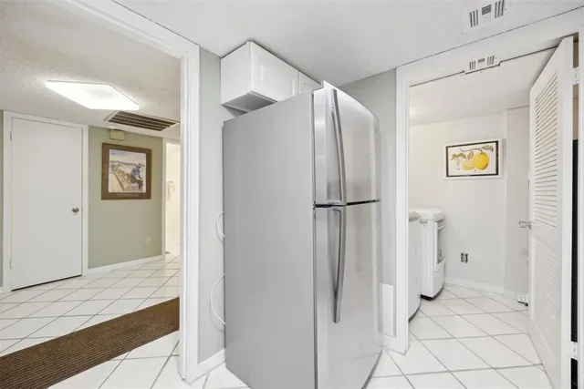 a bathroom with a glass shower door and a sink
