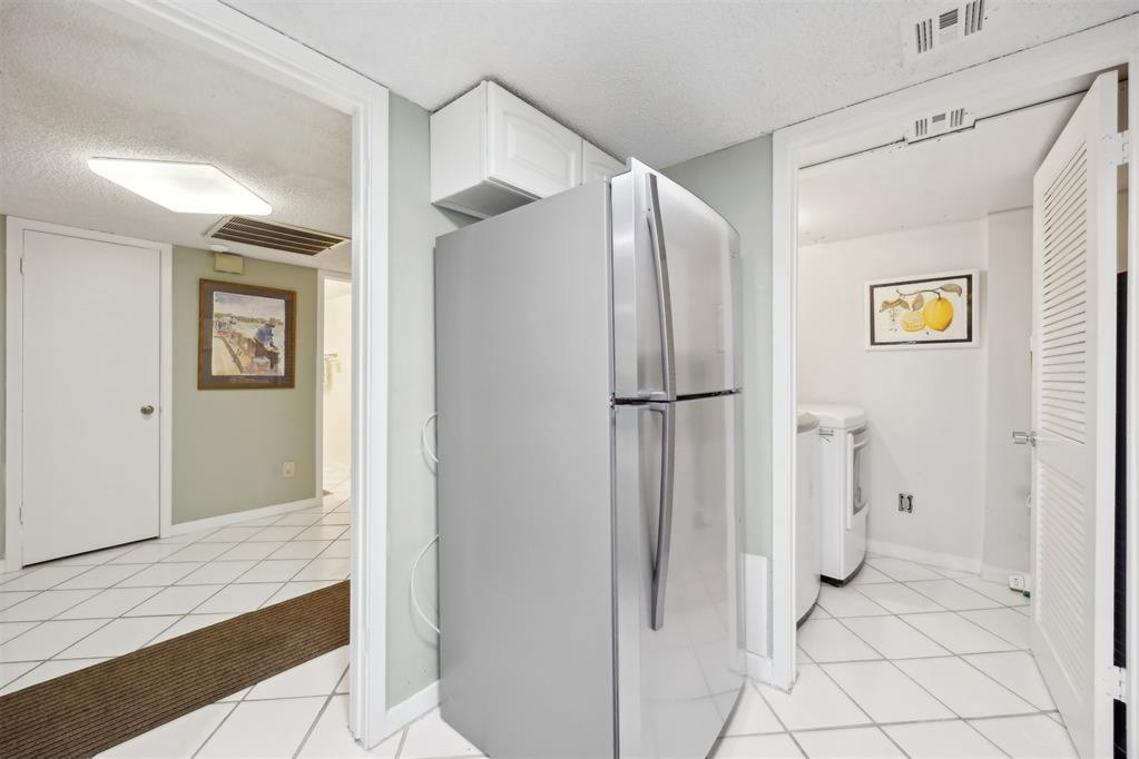 2021 Beachwood Road, Unit 2021 Fernandina Beach, FL 32034 - Photo 12 of 32 a bathroom with a glass shower door and a sink