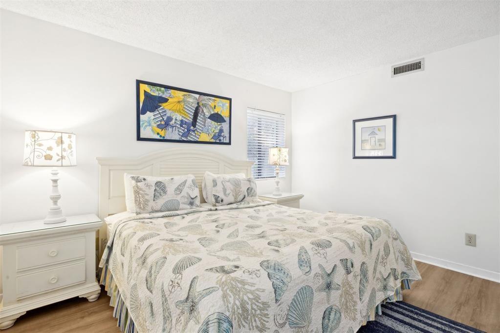 2021 Beachwood Road, Unit 2021 Fernandina Beach, FL 32034 - Photo 13 of 32 a bedroom with a large bed and a window