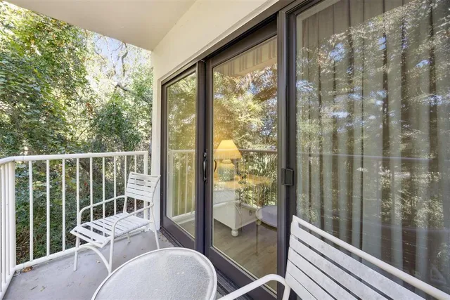 a balcony with chairs