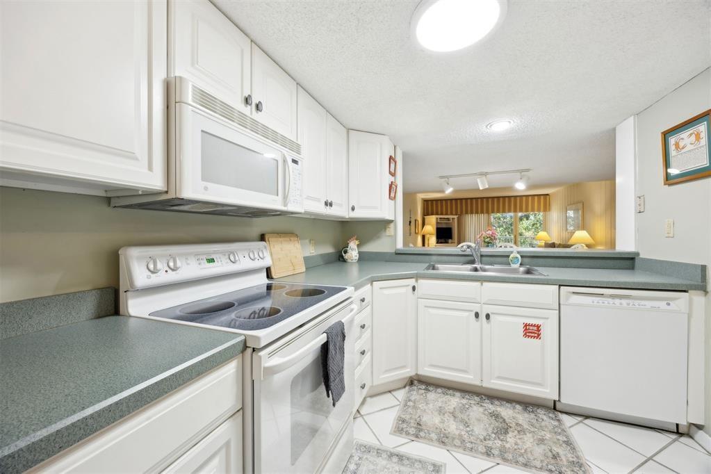 2021 Beachwood Road, Unit 2021 Fernandina Beach, FL 32034 - Photo 4 of 32 a kitchen with a sink cabinets and appliances