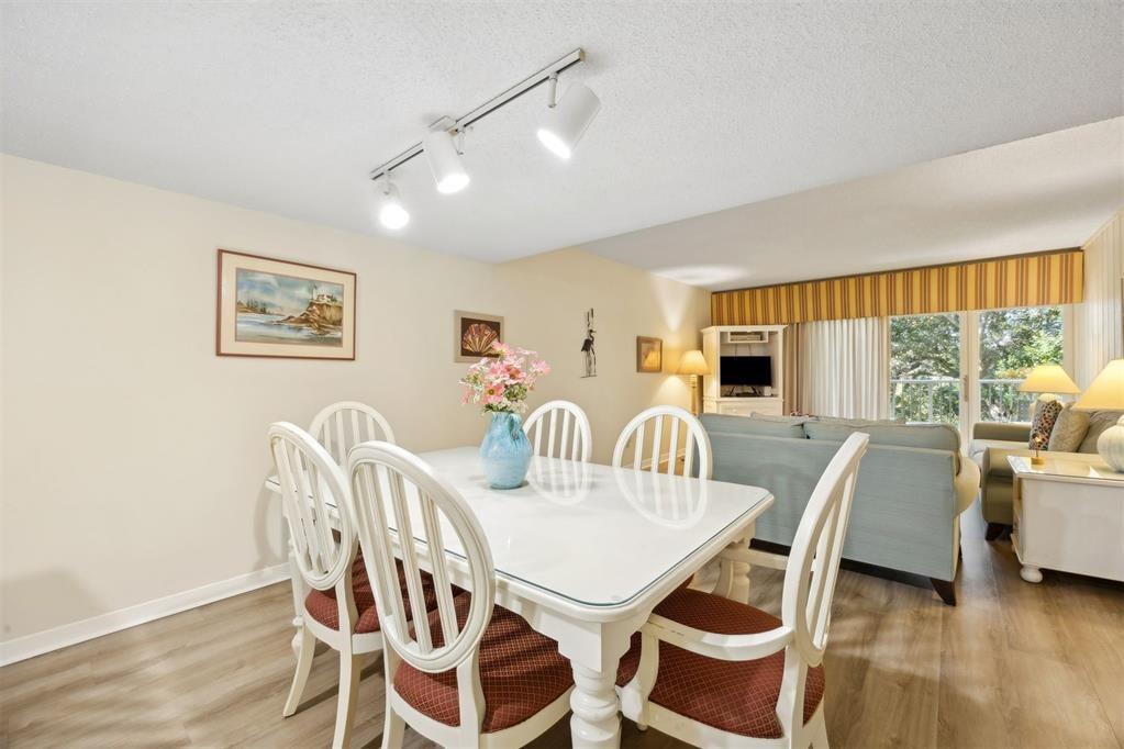 2021 Beachwood Road, Unit 2021 Fernandina Beach, FL 32034 - Photo 6 of 32 a view of a dining room with furniture window and wooden floor