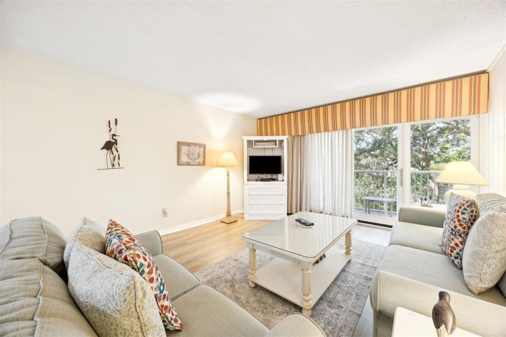 2021 Beachwood Road, Unit 2021 Fernandina Beach, FL 32034 - Photo 7 of 32 a living room with furniture and a flat screen tv