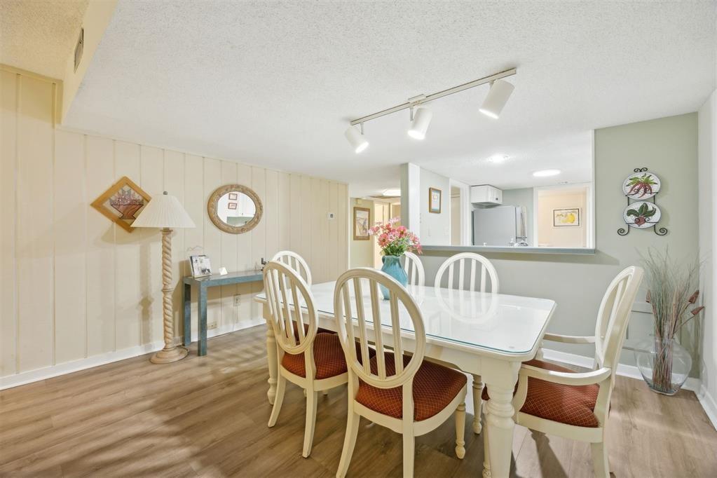 2021 Beachwood Road, Unit 2021 Fernandina Beach, FL 32034 - Photo 8 of 32 a view of a dining room with furniture and wooden floor