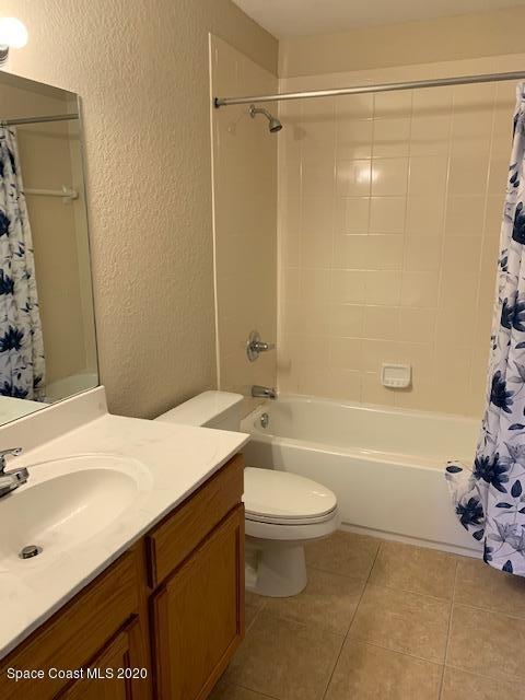 110 Colibri Way, Unit 105 Melbourne, FL 32901 - Photo 13 of 16 a bathroom with a sink toilet and shower