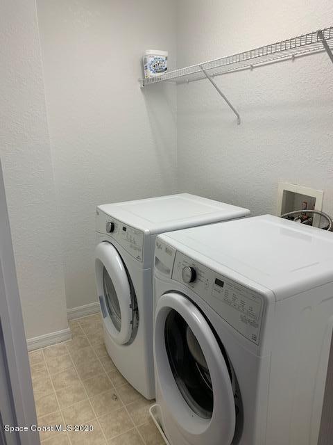 110 Colibri Way, Unit 105 Melbourne, FL 32901 - Photo 15 of 16 a utility room with dryer and washer