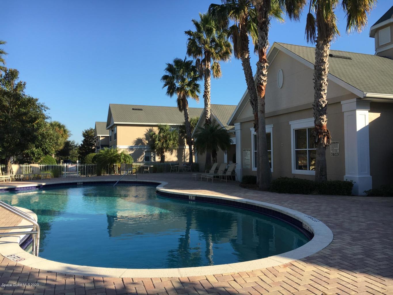 110 Colibri Way, Unit 105 Melbourne, FL 32901 - Photo 16 of 16 a view of swimming pool with outdoor seating and plants