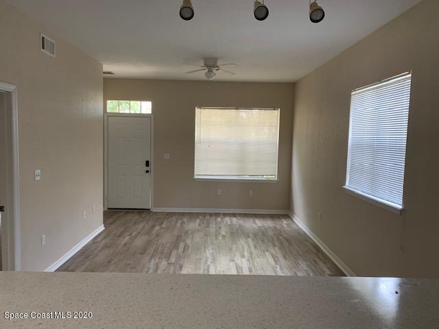 110 Colibri Way, Unit 105 Melbourne, FL 32901 - Photo 6 of 16 an empty room with windows