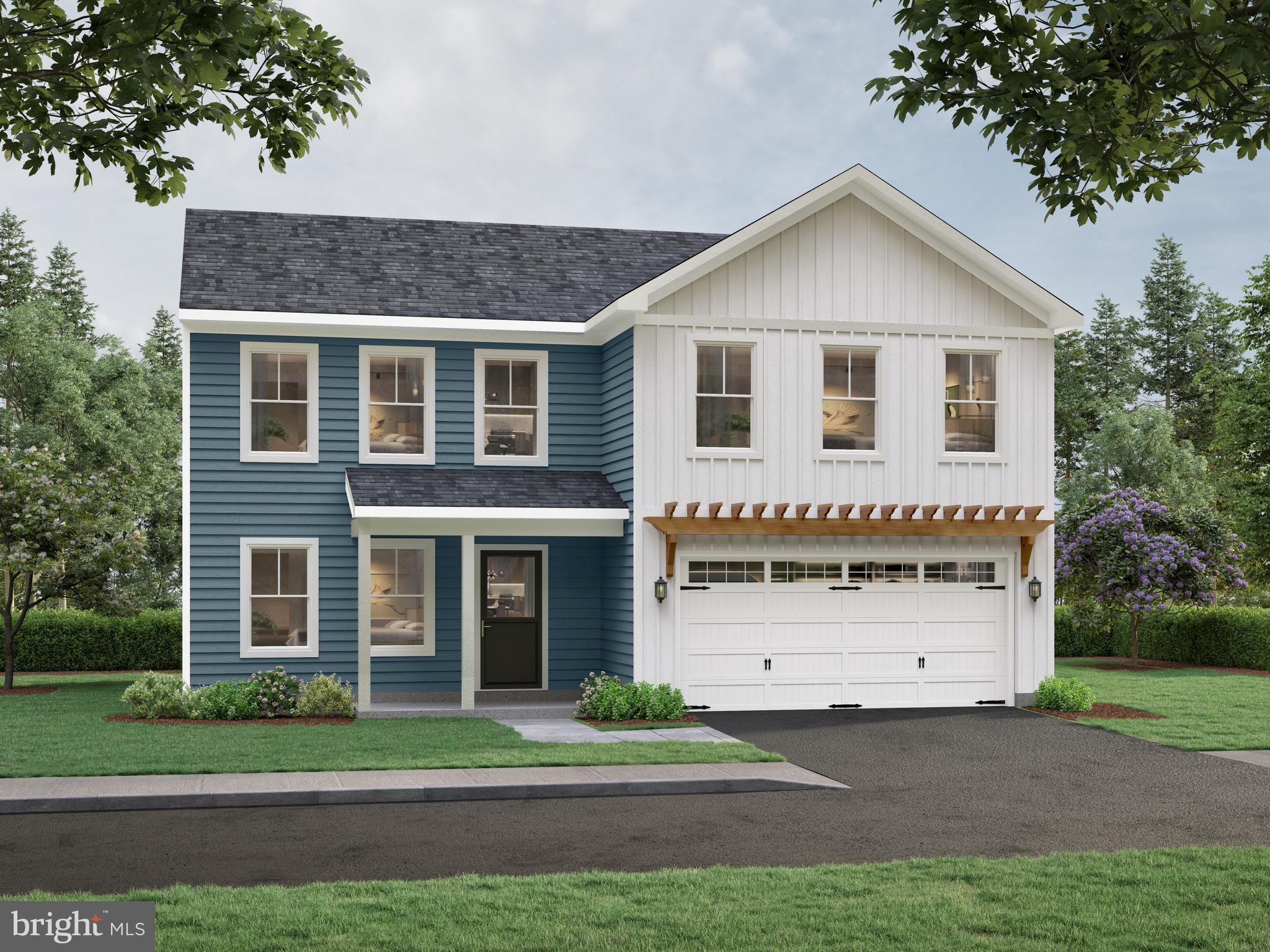 33 North Dupont Boulevard Georgetown, DE 19947 - Photo 3 of 12 a front view of a house with a garden and plants