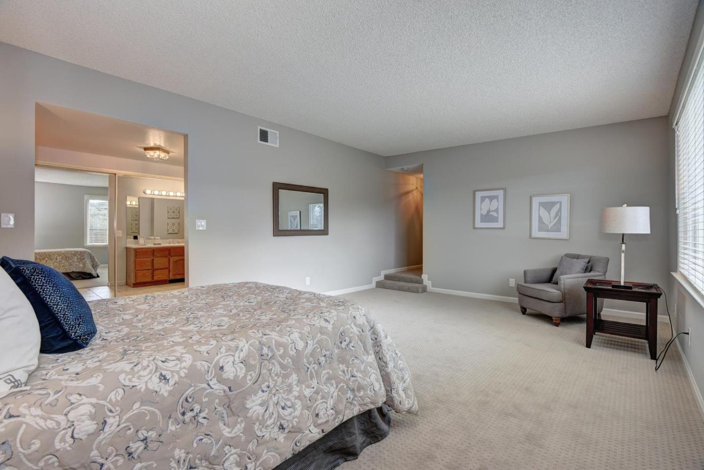 6429 McAbee Road San Jose, CA 95120 - Photo 16 of 28 a bedroom with a bed and furniture