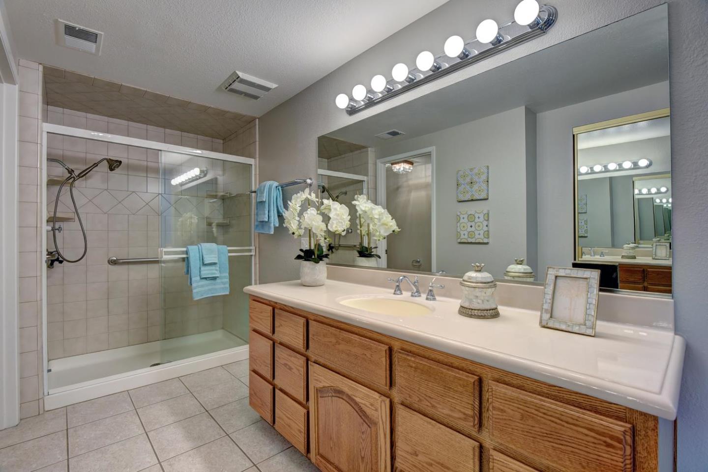 6429 McAbee Road San Jose, CA 95120 - Photo 17 of 28 a bathroom with a sink shower and a mirror