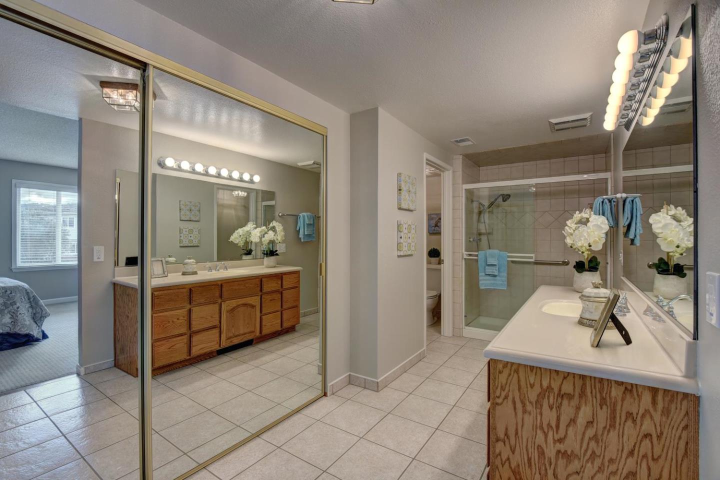 6429 McAbee Road San Jose, CA 95120 - Photo 18 of 28 a spacious bathroom with a sink a mirror and shower