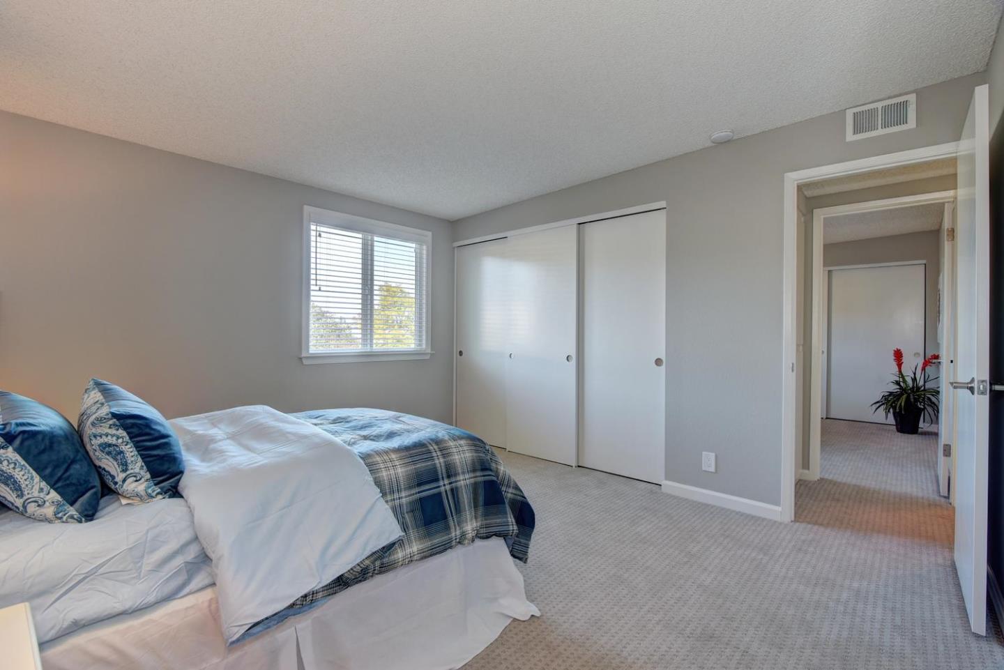 6429 McAbee Road San Jose, CA 95120 - Photo 21 of 28 a bedroom with a bed and a window