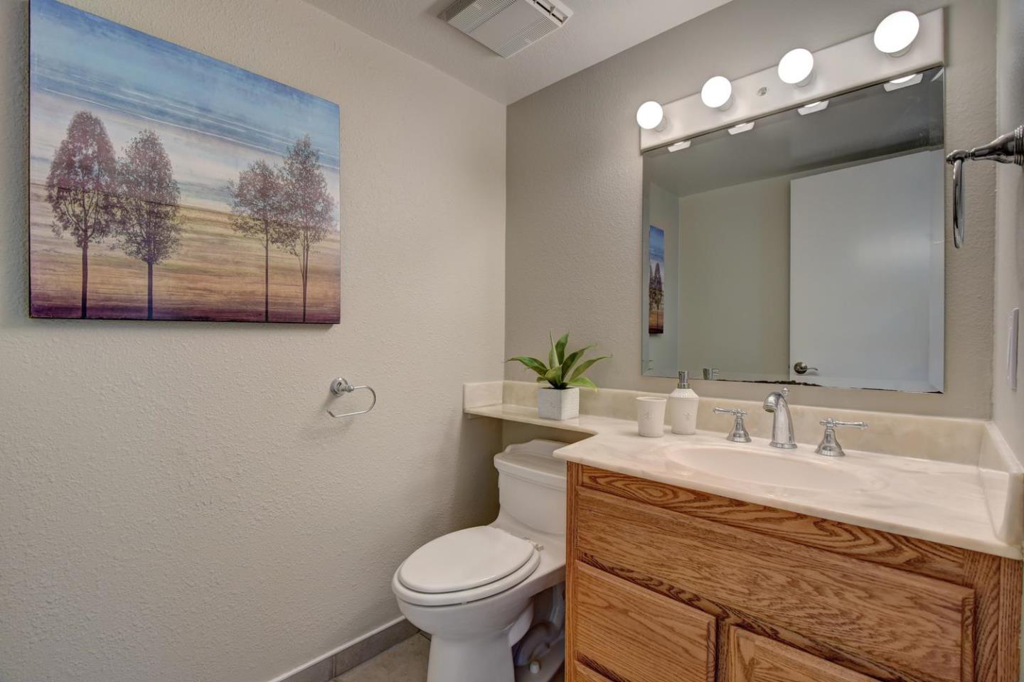 6429 McAbee Road San Jose, CA 95120 - Photo 24 of 28 a bathroom with a toilet sink and mirror