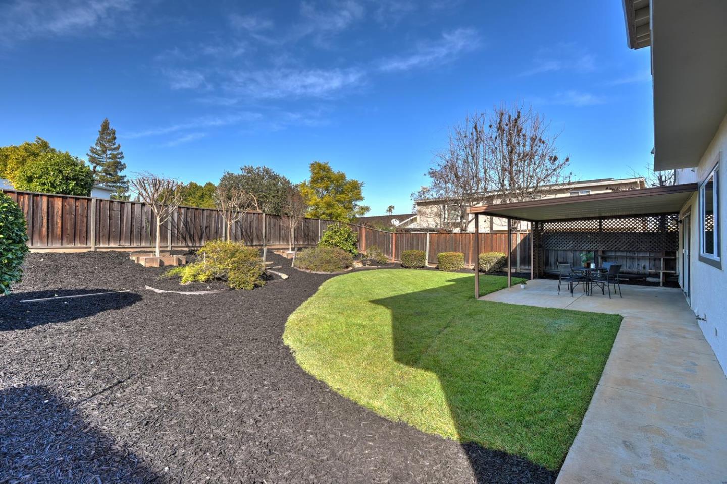 6429 McAbee Road San Jose, CA 95120 - Photo 26 of 28 a view of a backyard with a garden and plants