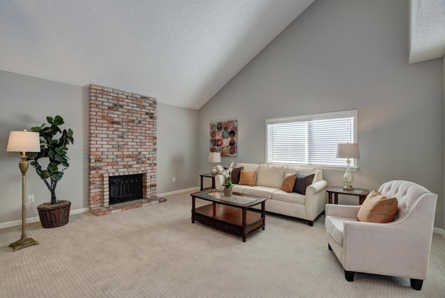 6429 McAbee Road San Jose, CA 95120 - Photo 4 of 28 a living room with furniture and a fireplace
