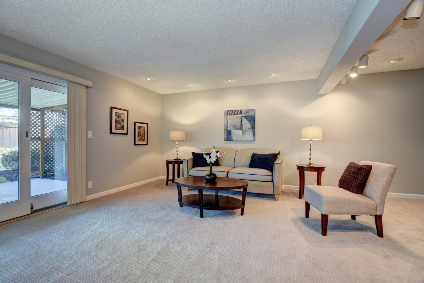 6429 McAbee Road San Jose, CA 95120 - Photo 9 of 28 a living room with furniture and a lamp