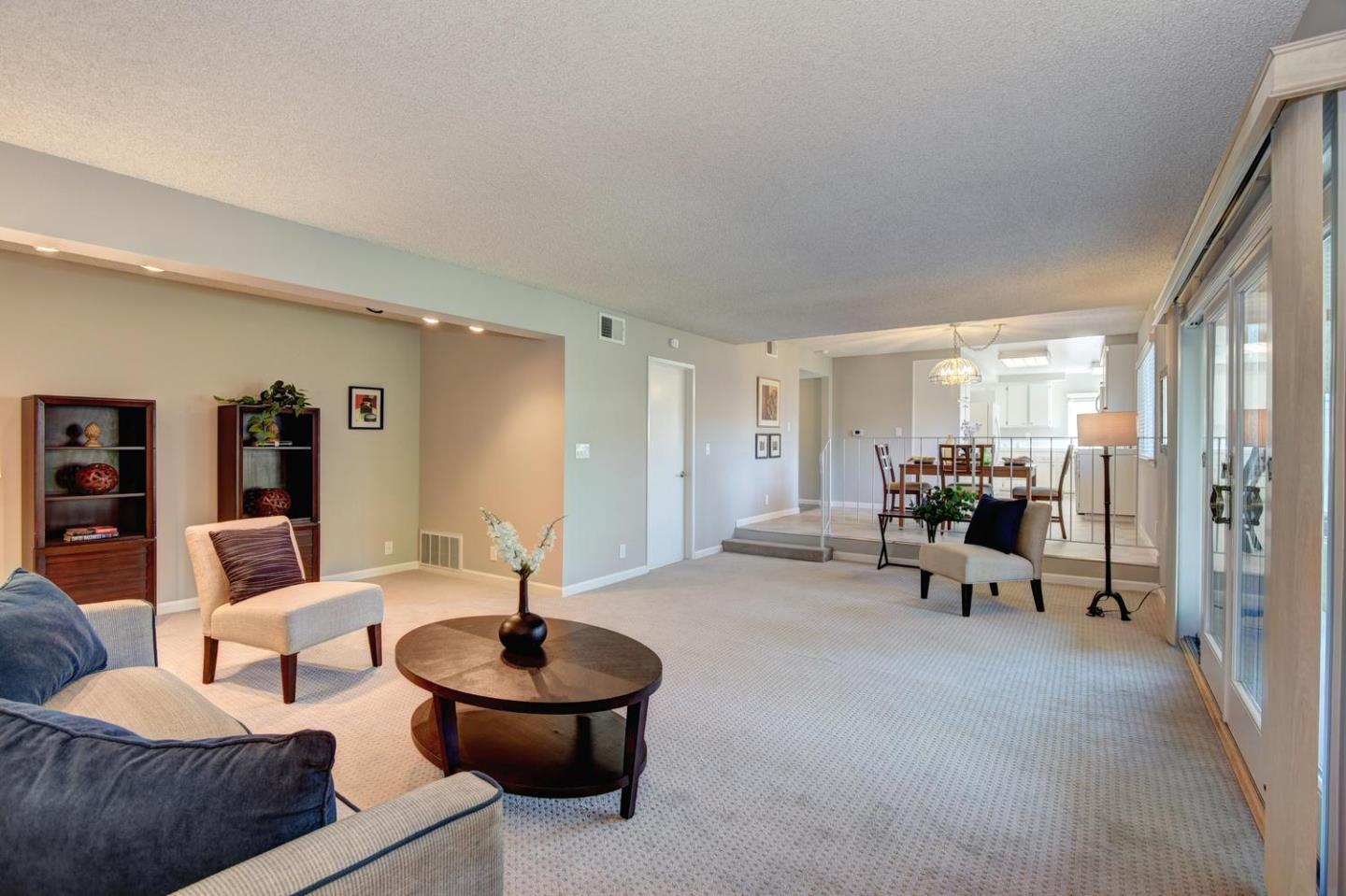 6429 McAbee Road San Jose, CA 95120 - Photo 10 of 28 a living room with furniture and a large window
