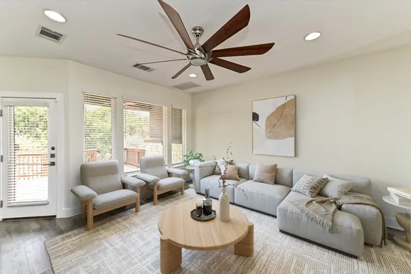 a kitchen with granite countertop stainless steel appliances a refrigerator microwave and stove top oven