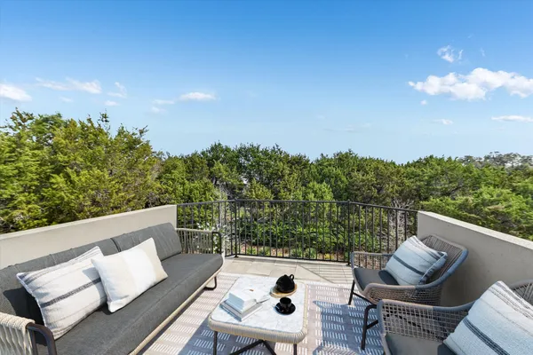 a view of a balcony with an outdoor space
