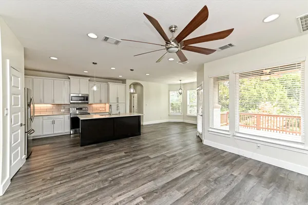 a living room with furniture and a large window