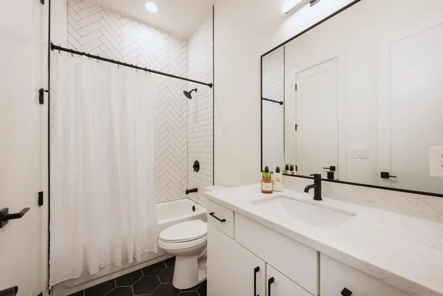 a view of a hallway with washer and dryer