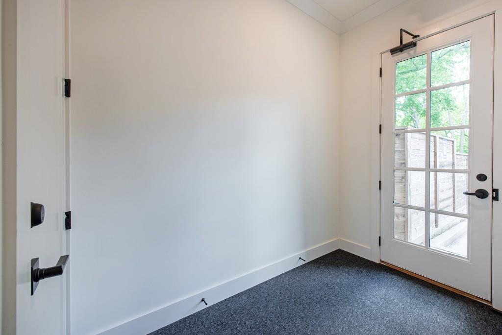 417 East College Avenue, Unit 102 Decatur, GA 30030 - Photo 26 of 60 a view of an empty room with a window