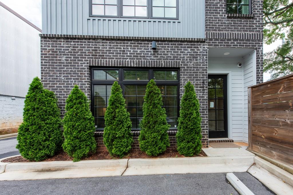 417 East College Avenue, Unit 102 Decatur, GA 30030 - Photo 29 of 60 a front view of a house with plants