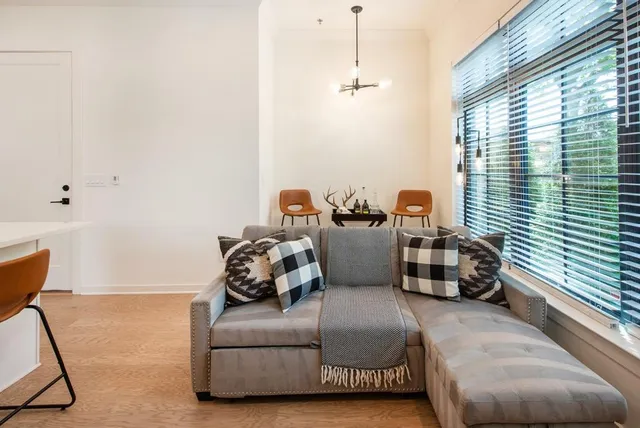 a living room with furniture and a window