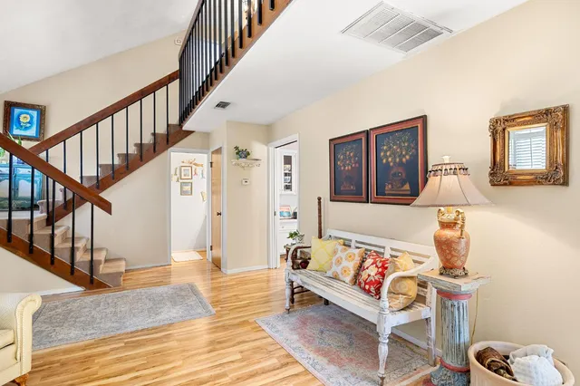 a living room with furniture and a rug