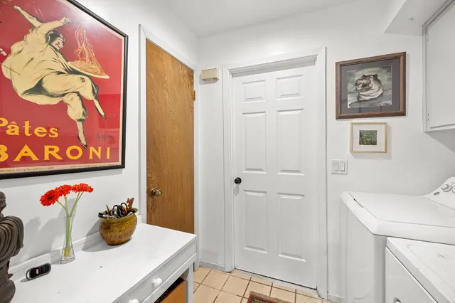 a bathroom with a mirror sink and vanity
