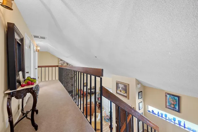 a view of a balcony with furniture