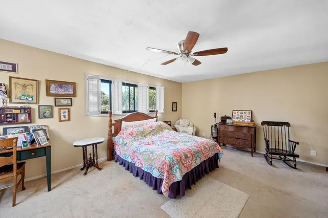 a bedroom with a bed and a walk in closet