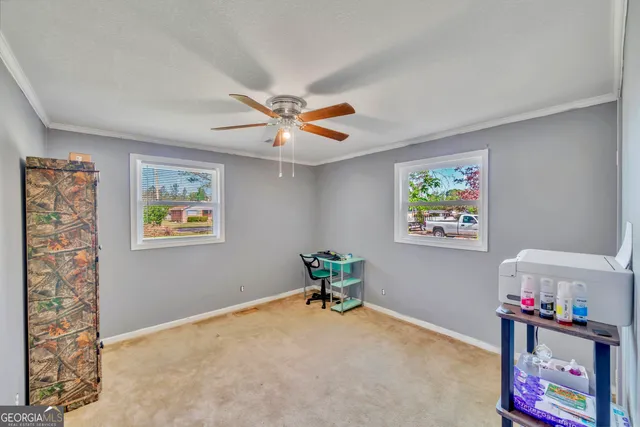 a workspace with furniture and window