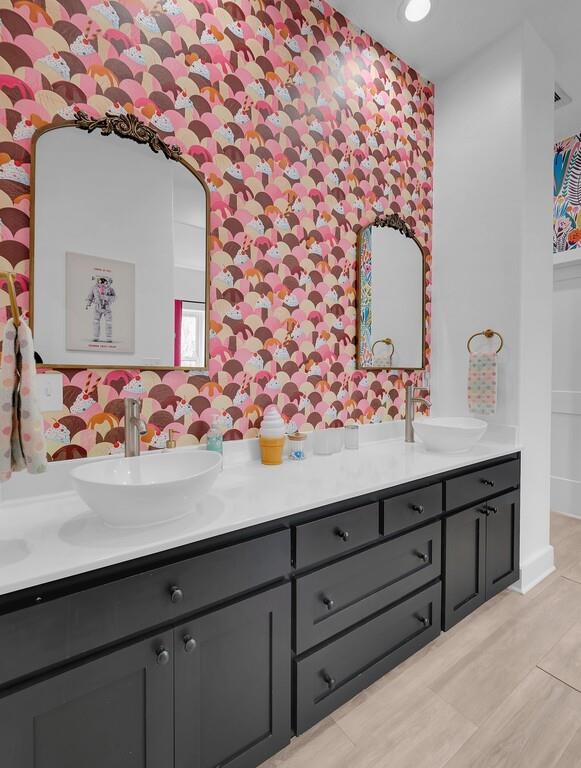 109 Springfield Lane Waco, TX 76705 - Photo 23 of 39 Bathroom with double vanity, wallpapered walls, and recessed lighting