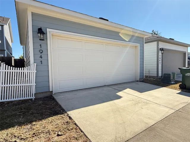 a view of a street with a building in the background