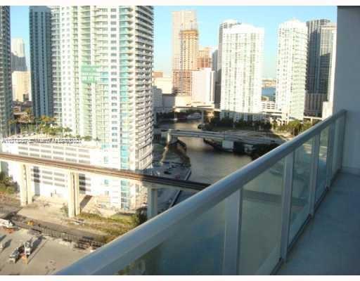 185 Southwest 7th Street, Unit 2207 Miami, FL 33130 - Photo 6 of 8 a view of a kitchen with a large window
