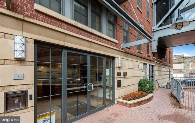 a view of a chair and tables in the balcony