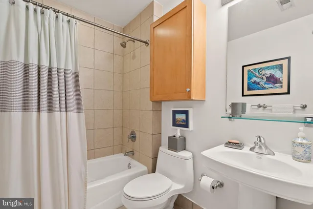 a kitchen with stainless steel appliances granite countertop a refrigerator a stove top oven a sink dishwasher and wooden cabinets