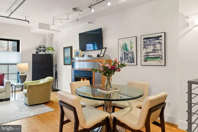 a dining room with furniture and window