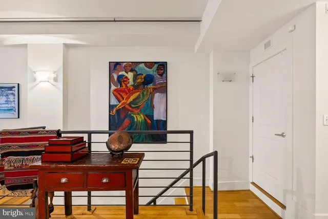 a work room with furniture and wooden floor