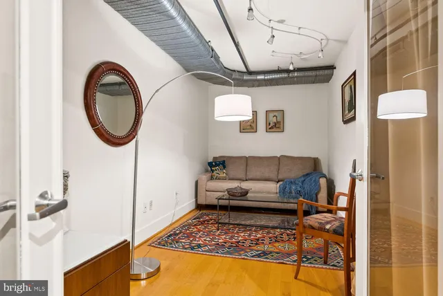 a living room with furniture and a rug