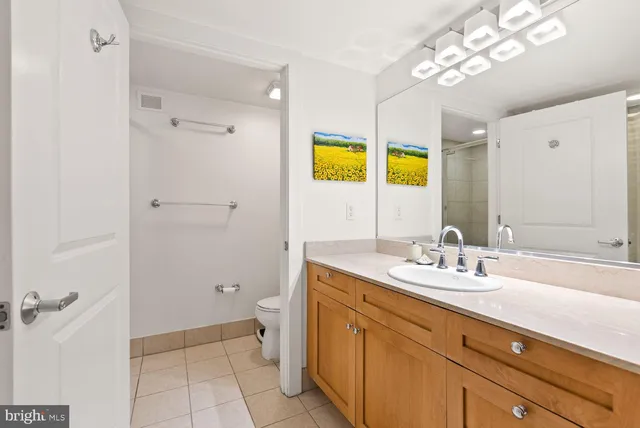 a bathroom with a sink a vanity and a mirror