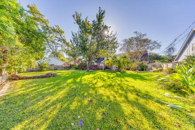 a view of yard with swimming pool