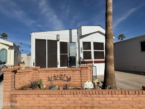 a view of a brick house with an outdoor space