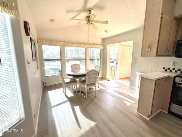 a view of a dining room with furniture window and wooden floor