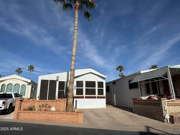 a front view of a house with parking space