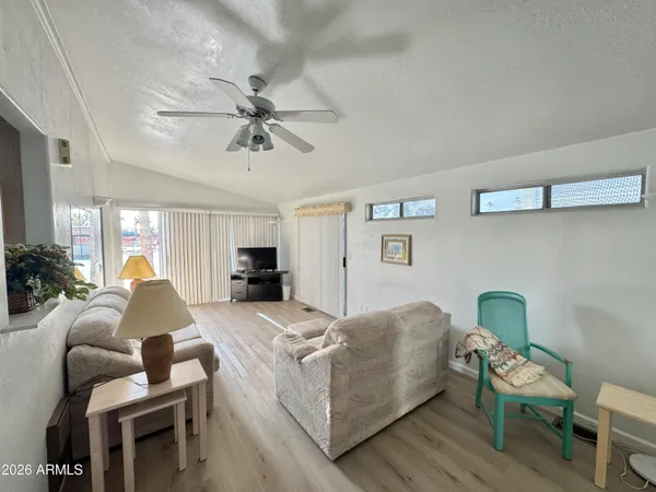 a living room with furniture and a window
