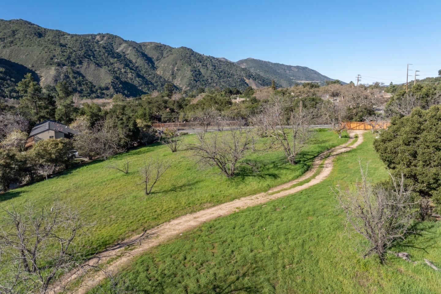 29 East Carmel Valley Road Carmel Valley, CA 93924 - Photo 5 of 15 a view of a lush green hillside and a mountain